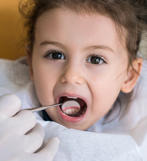 young girl having dental checkup