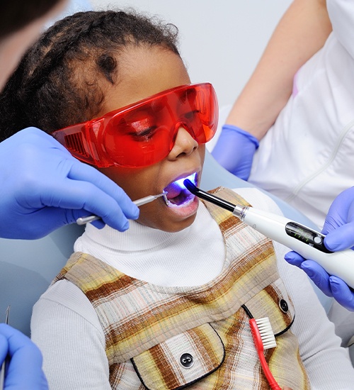 young girl getting a dental sealants