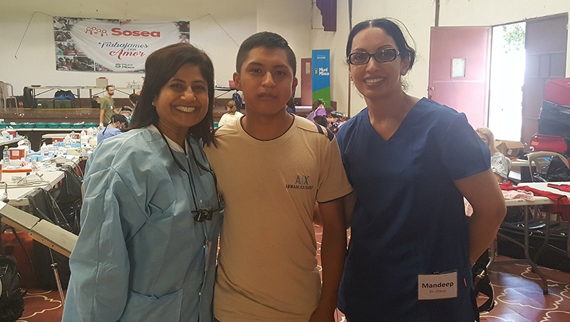 Dr. Kurian, Dr. Chana, and patient smiling