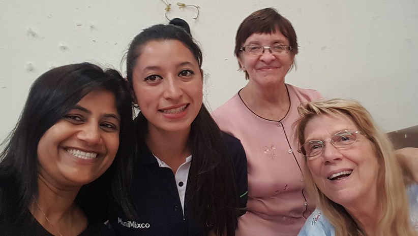 Dr. Kurian smiling with other doctors