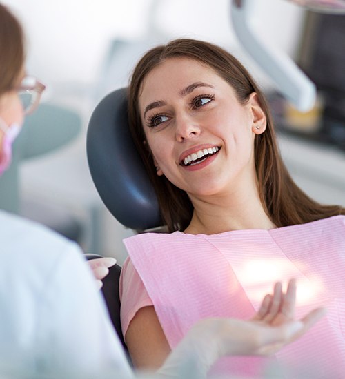 woman smiling at female dentist