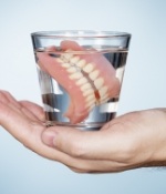 dentures in a glass of water