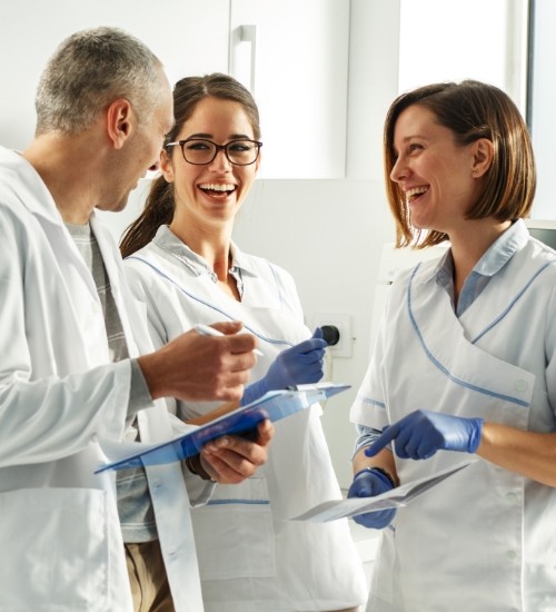 three dentist speaking to each other