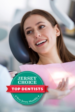 woman laying back in exam chair smiling