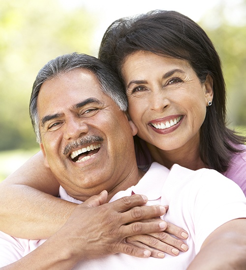 woman hugging husband